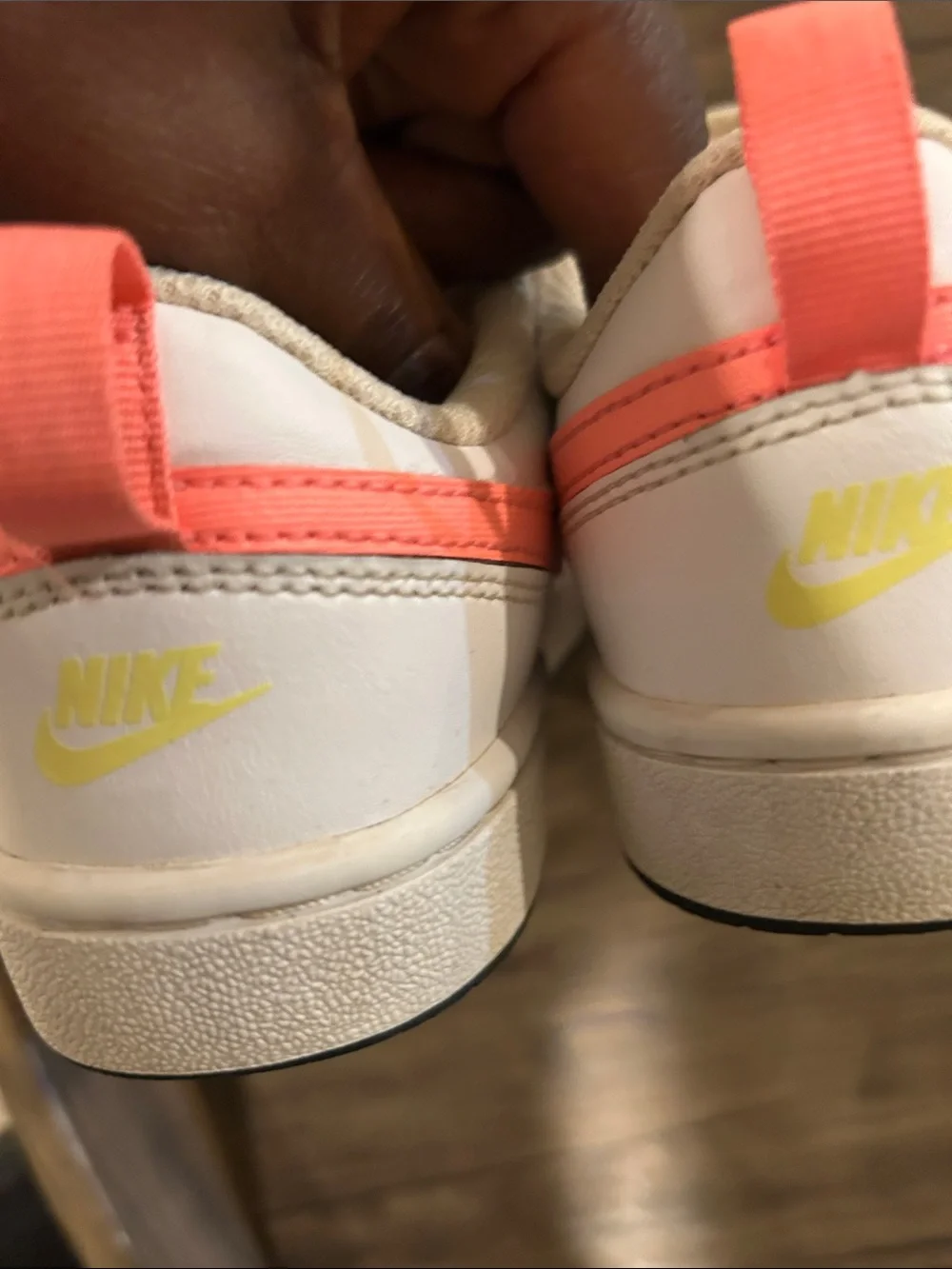 Nike Kids White Sneakers with Coral Swoosh and Yellow Tongue